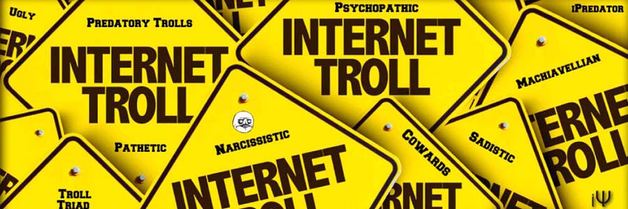 yellow signs with 'internet troll" written on them