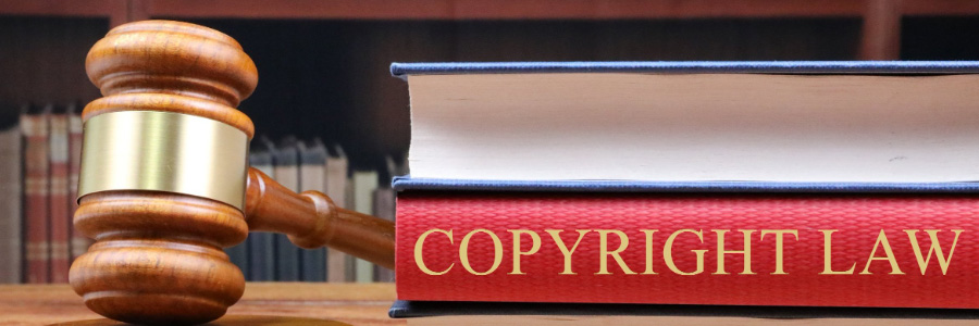 A gavel beside a book on Copyright Law