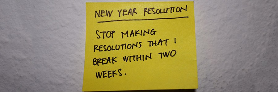 A post it with "New Year Resolution - Stop making resolutions that I break within two weeks" written on it 