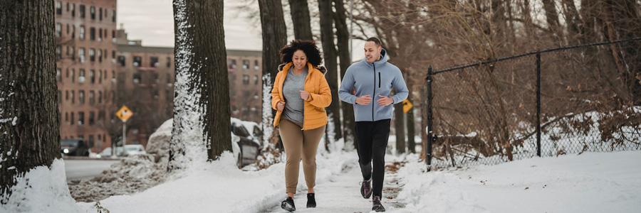 Two people jogging in winter.