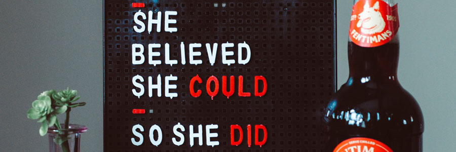 A sign that says, 'She Believed She Could So She Did'.