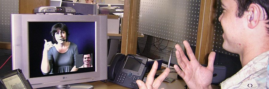 A man holding a video call through computer