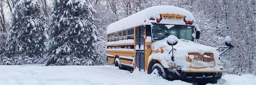 school bus covered in snow