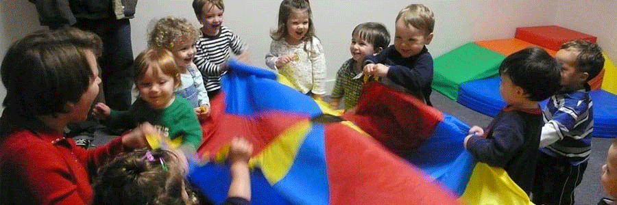 Kids playing with a colourful cloth